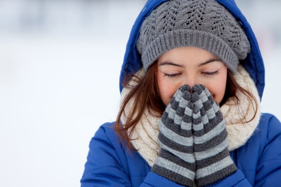 image woman in snow with hat and gloves
